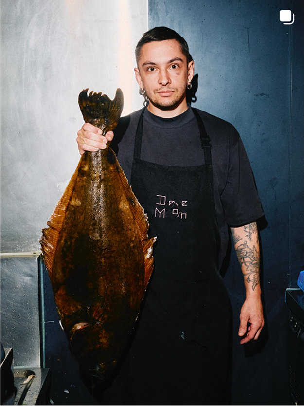 Saltz chef holding a flatfish